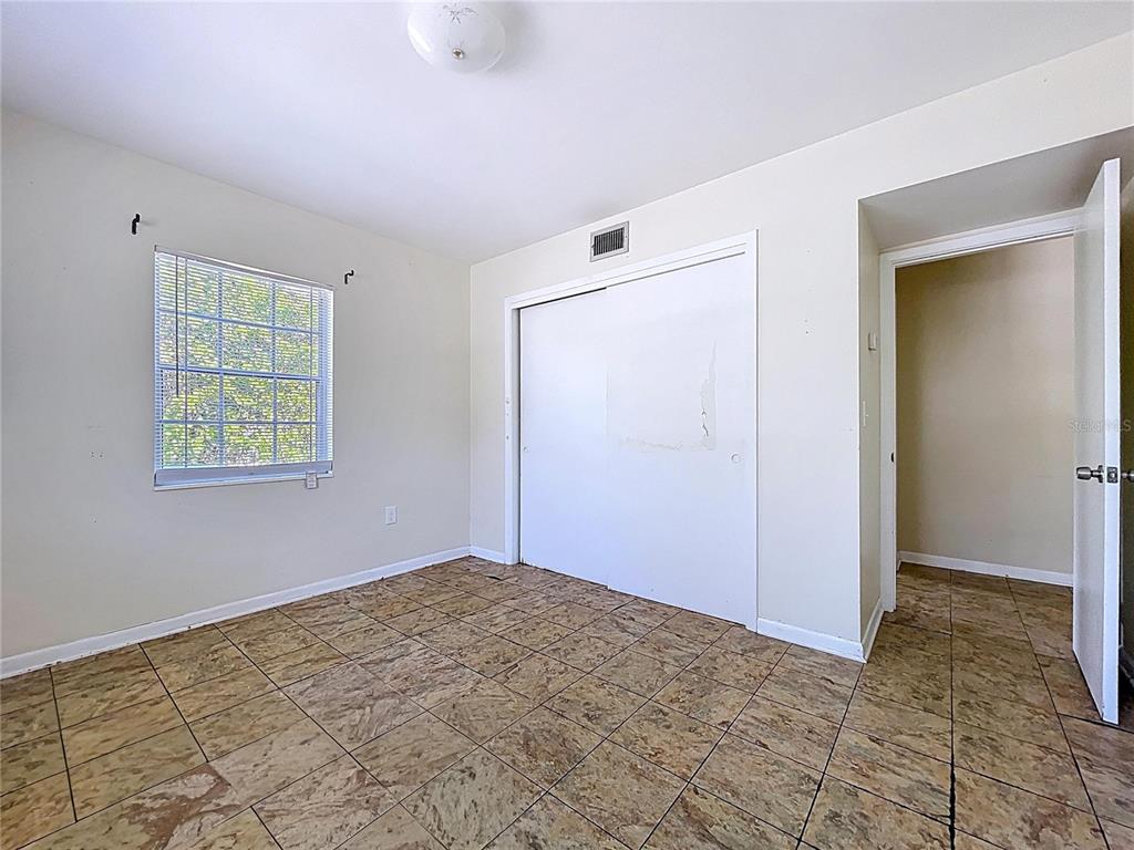 501 Spring Avenue Anna Maria, FL 34216 - Photo 34 of 49 an empty room with windows