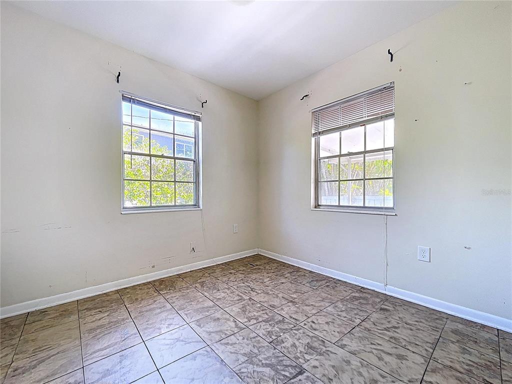 501 Spring Avenue Anna Maria, FL 34216 - Photo 42 of 49 an empty room with windows