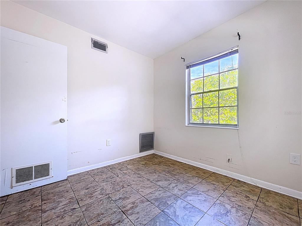 501 Spring Avenue Anna Maria, FL 34216 - Photo 43 of 49 a view of an empty room with a window