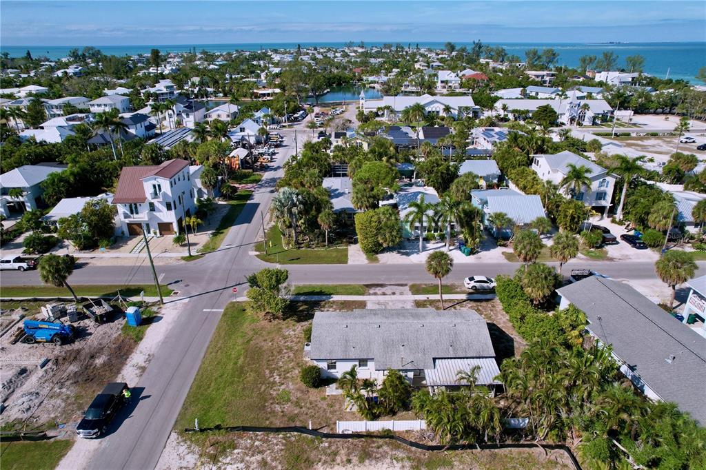 501 Spring Avenue Anna Maria, FL 34216 - Photo 47 of 49 an aerial view of multiple houses with yard