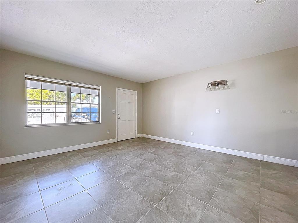 501 Spring Avenue Anna Maria, FL 34216 - Photo 8 of 49 an empty room with windows