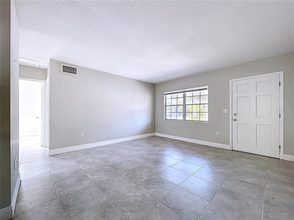 501 Spring Avenue Anna Maria, FL 34216 - Photo 9 of 49 an empty room with windows