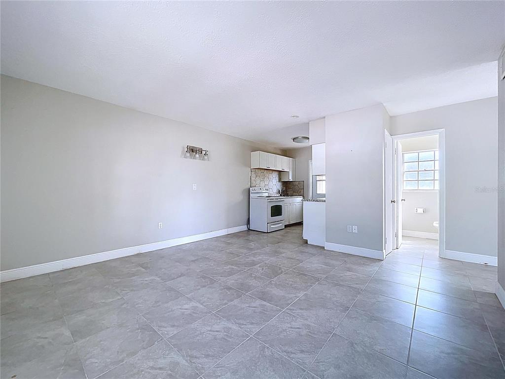 501 Spring Avenue Anna Maria, FL 34216 - Photo 10 of 49 a view of a livingroom and a kitchen