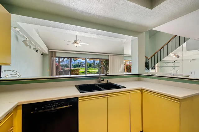 a kitchen with a sink and a microwave