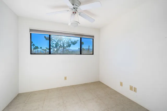 a view of a chairs and table in backyard