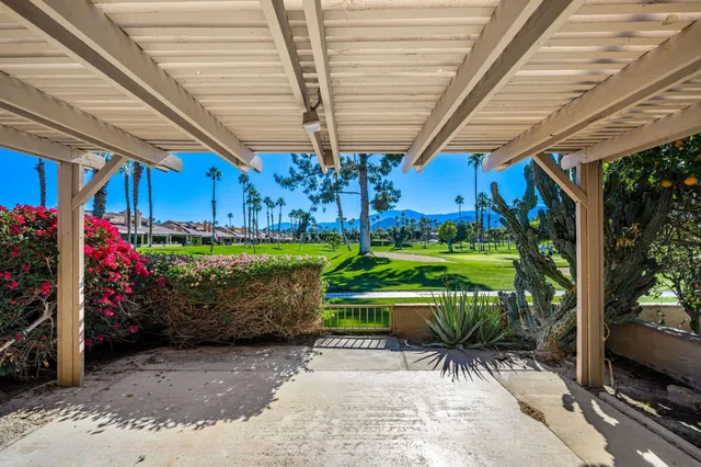 a view of a chair and tables in patio
