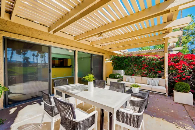 a front view of a building with seating space