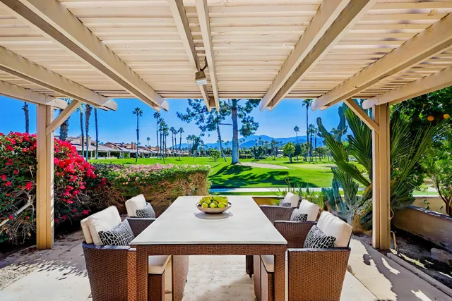 a view of a park with palm trees