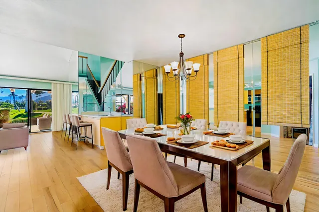 a view of an entryway with wooden floor and windows