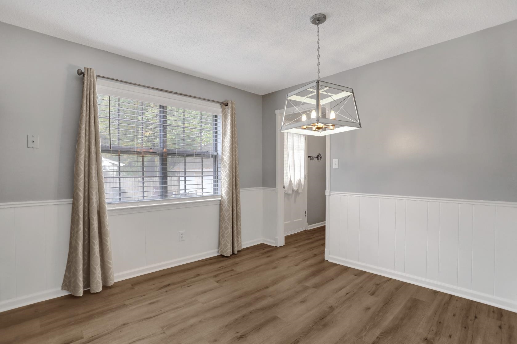 372 Dove Valley Road Collierville, TN 38017 - Photo 15 of 32 a view of a room with wooden floor chandelier and windows