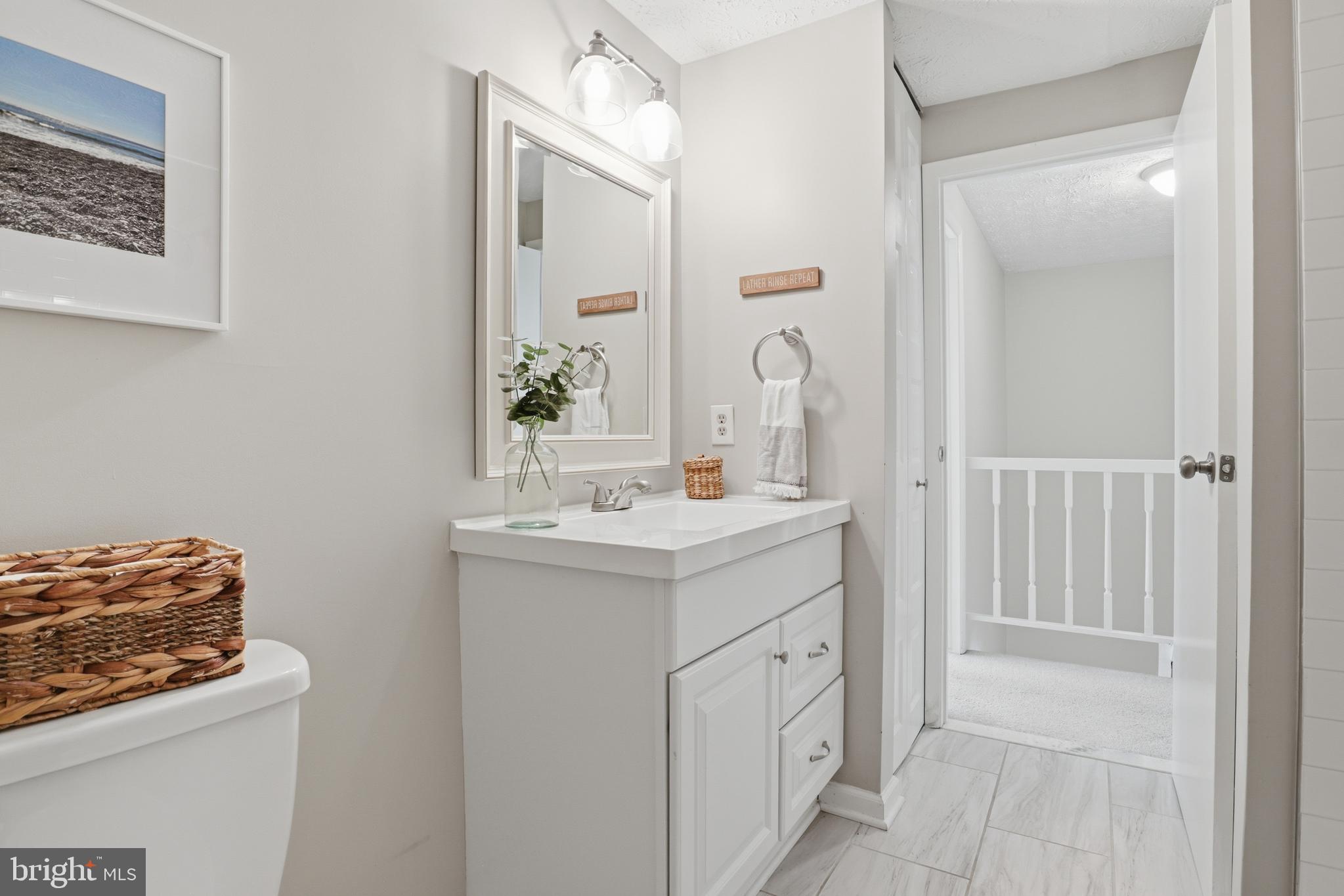 8033 Orange Plank Road Springfield, VA 22153 - Photo 12 of 26 Upper level full hall bathroom with tub