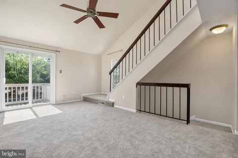 a view of an empty room with stairs