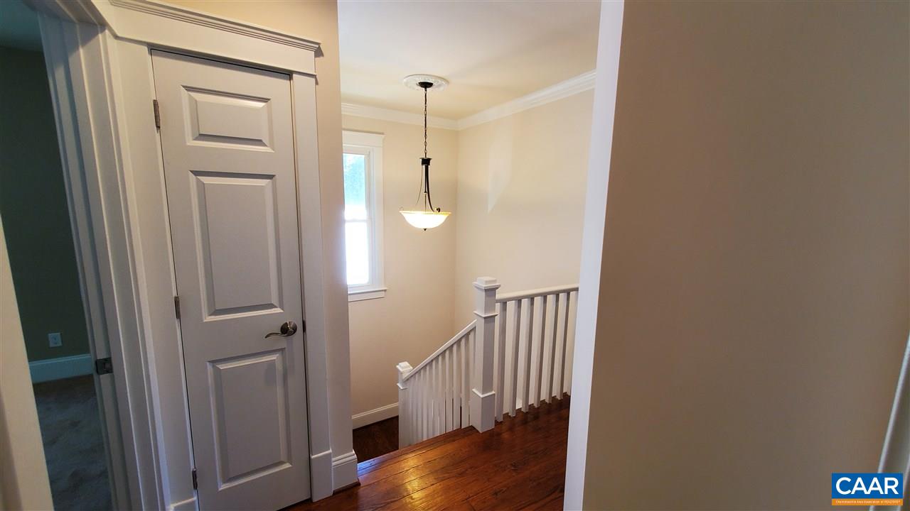 3007 Morgantown Road Charlottesville, VA 22903 - Photo 14 of 30 a view of a hallway with wooden floor and staircase
