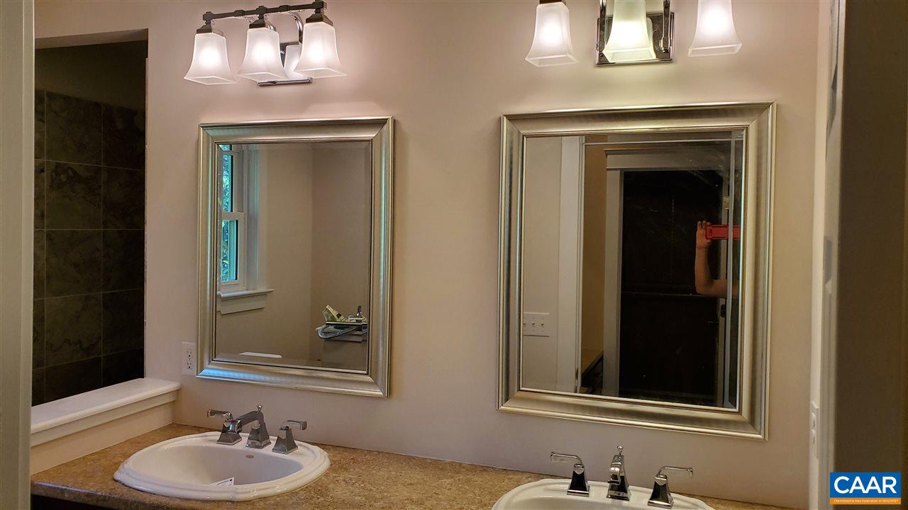 3007 Morgantown Road Charlottesville, VA 22903 - Photo 15 of 30 a bathroom with a sink and a mirror