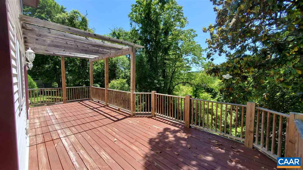 3007 Morgantown Road Charlottesville, VA 22903 - Photo 22 of 30 a view of deck with wooden floor and fence next to a yard