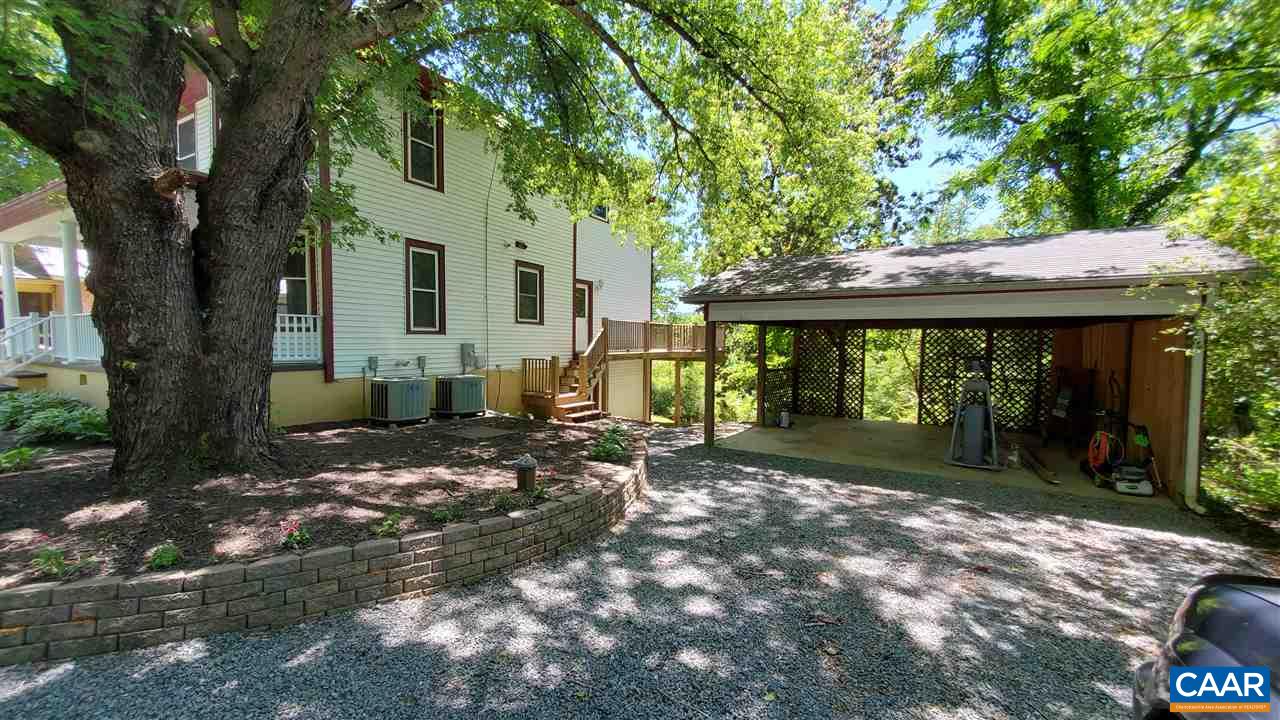 3007 Morgantown Road Charlottesville, VA 22903 - Photo 25 of 30 a view of a house with a large tree and a yard