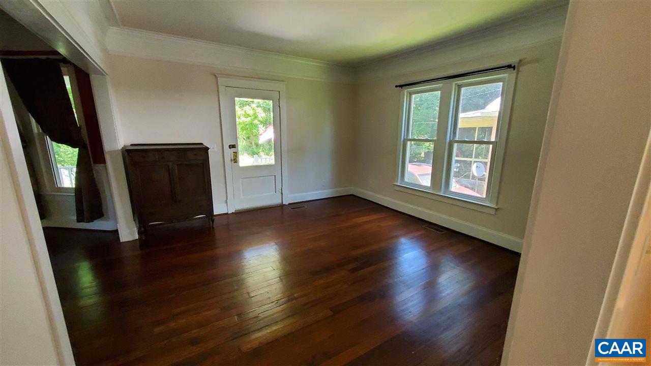 3007 Morgantown Road Charlottesville, VA 22903 - Photo 4 of 30 an empty room with wooden floor and windows