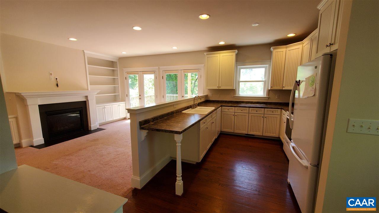 3007 Morgantown Road Charlottesville, VA 22903 - Photo 5 of 30 a kitchen with granite countertop sink stove and refrigerator