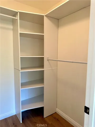 a view of an empty walk in closet