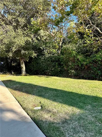 a view of swimming pool with a yard