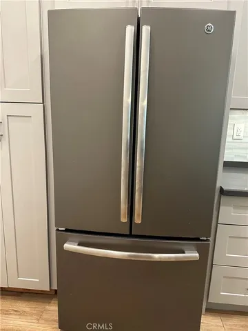 a view of a closet with wooden floor