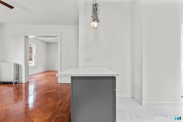 a view of livingroom with hardwood floor and a sink