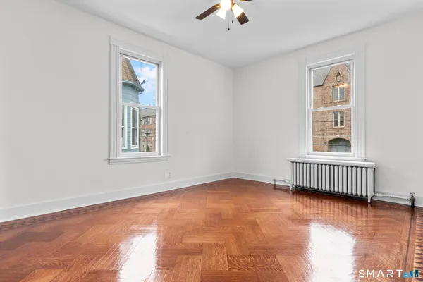 a view of an empty room with a window
