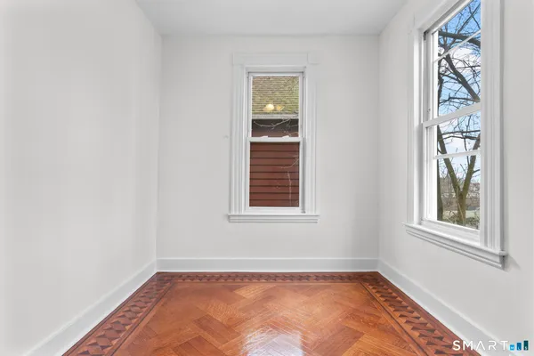 a view of an empty room with a window