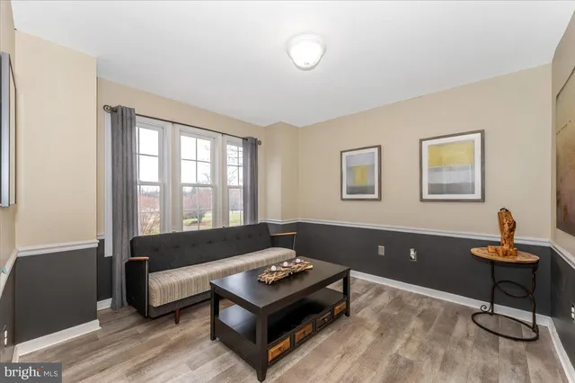 a view of a hallway with windows and stairs