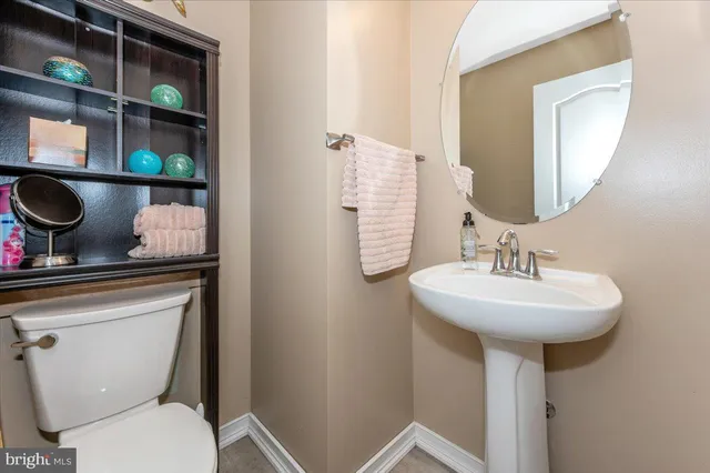 a bedroom with a bed and a television