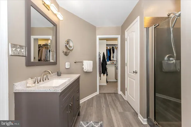 a living room with a couch and a book shelf
