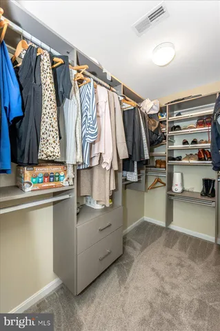 a front view of a house with swimming pool having outdoor seating