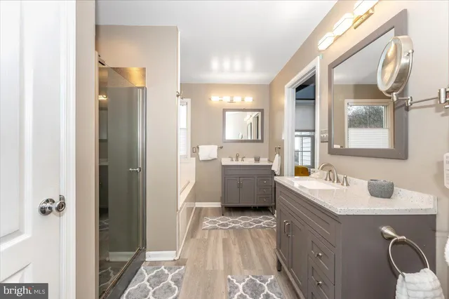 a view of a patio with a table and chairs and potted plants