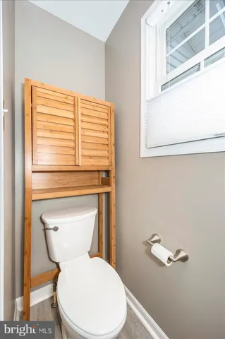 a view of a patio with table and chairs and potted plants