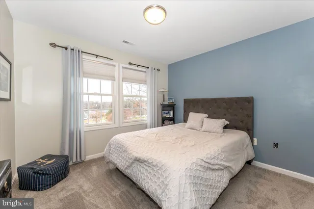 a view of a patio with table and chairs and potted plants