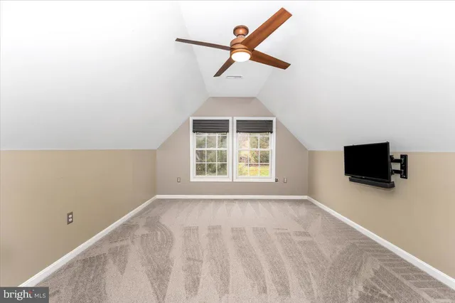 a view of a backyard with swimming pool