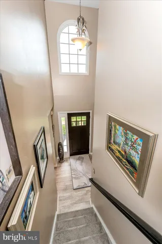 a living room with furniture fireplace and a window