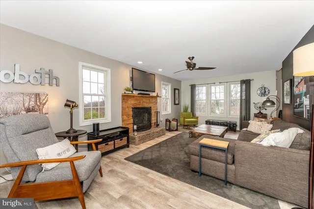 a kitchen with stainless steel appliances granite countertop a stove top oven a sink dishwasher and a refrigerator