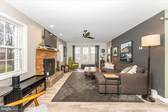 a kitchen with stainless steel appliances granite countertop a refrigerator sink stove microwave and cabinets