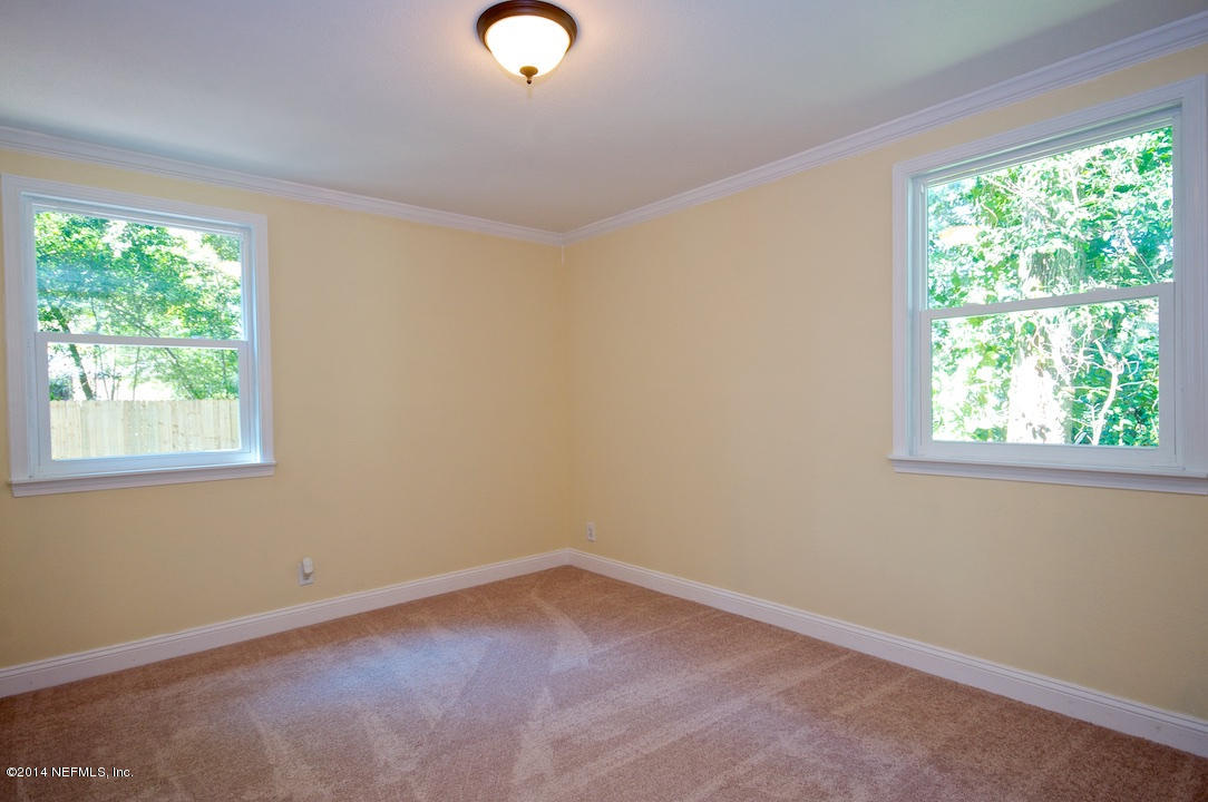 5614 Stetson Road Jacksonville, FL 32207 - Photo 14 of 20 an empty room with a window