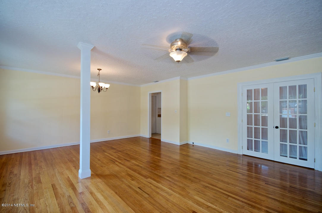 5614 Stetson Road Jacksonville, FL 32207 - Photo 5 of 20 wooden floor in an empty room with a window