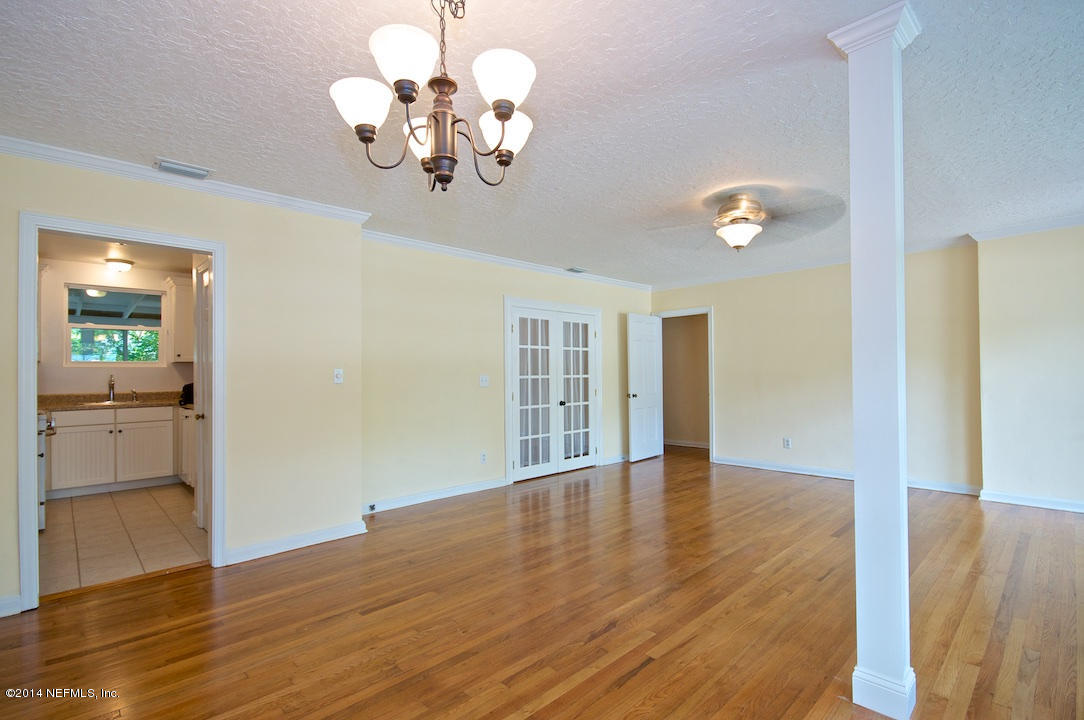 5614 Stetson Road Jacksonville, FL 32207 - Photo 6 of 20 a view of an empty room with wooden floor
