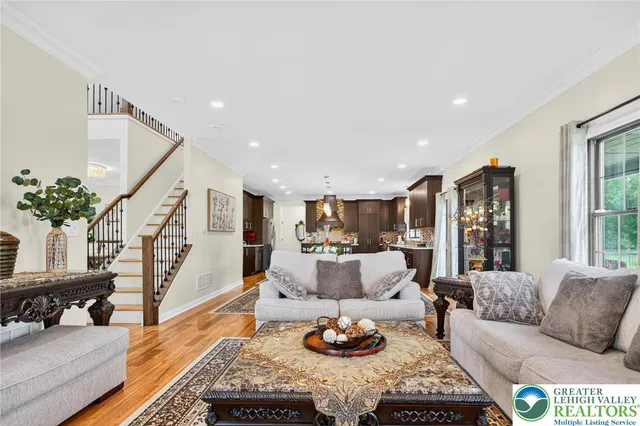 a spacious bedroom with a bed and a potted plant
