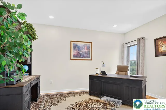 a kitchen with stainless steel appliances kitchen island granite countertop a sink stove and refrigerator