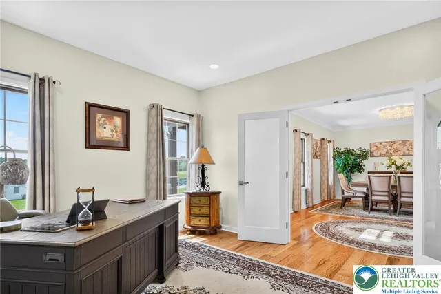 a kitchen with stainless steel appliances granite countertop a sink and a refrigerator