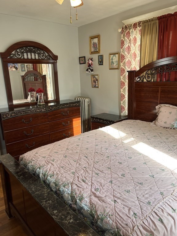 111 Wilber Street Springfield, MA 01104 - Photo 11 of 26 a bedroom with a bed window and a dresser