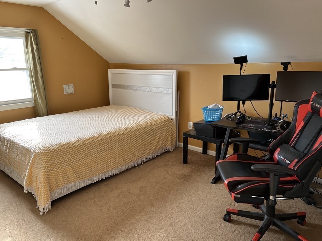 111 Wilber Street Springfield, MA 01104 - Photo 12 of 26 a bedroom with a bed and a furniture