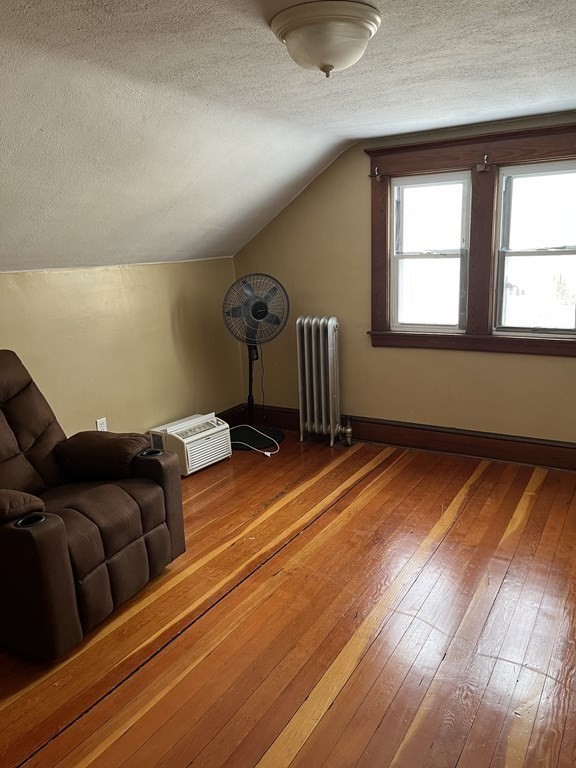 111 Wilber Street Springfield, MA 01104 - Photo 14 of 26 a room with furniture and a window