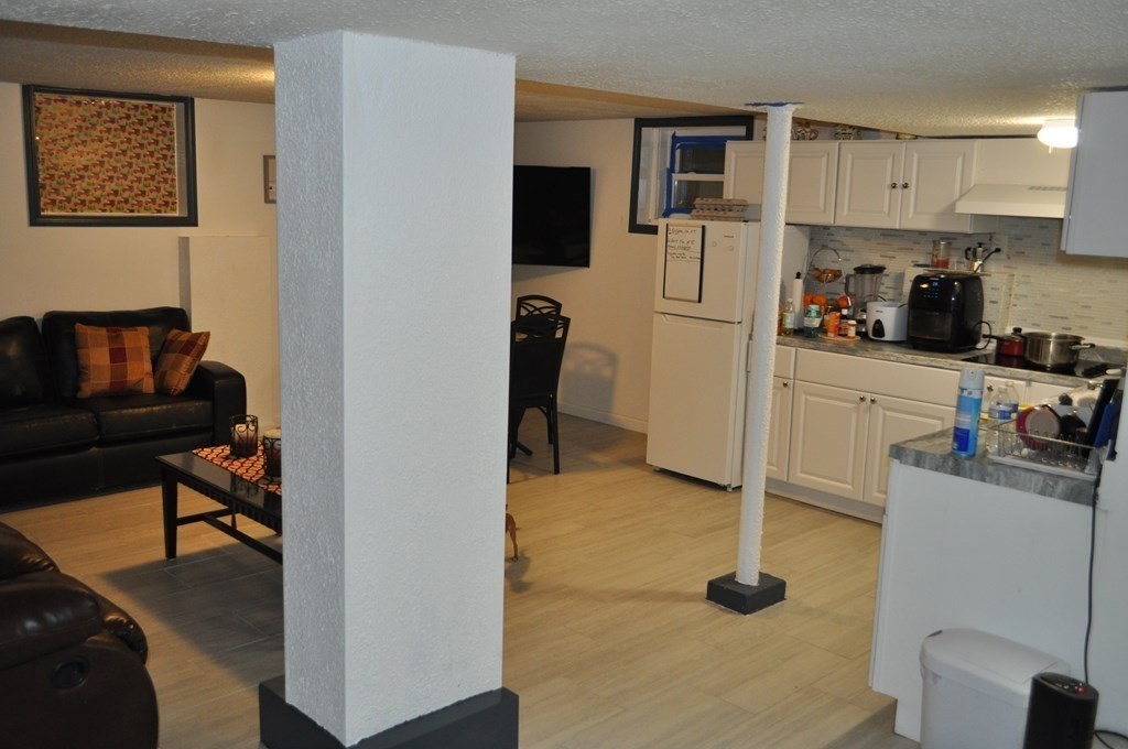 111 Wilber Street Springfield, MA 01104 - Photo 20 of 26 a view of a kitchen with fridge and workspace