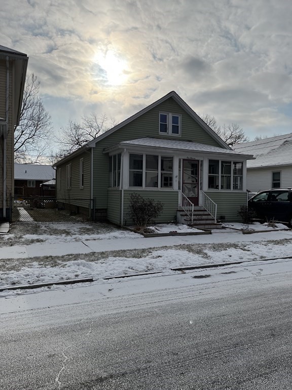 111 Wilber Street Springfield, MA 01104 - Photo 2 of 26 a front view of a house with a yard and potted plants